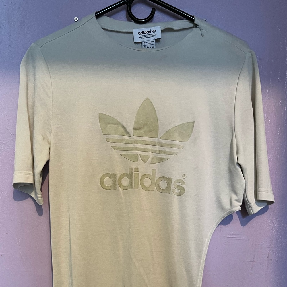 Cream Adidas top, with a swoop on the left starting at the waist. Sz UK 12